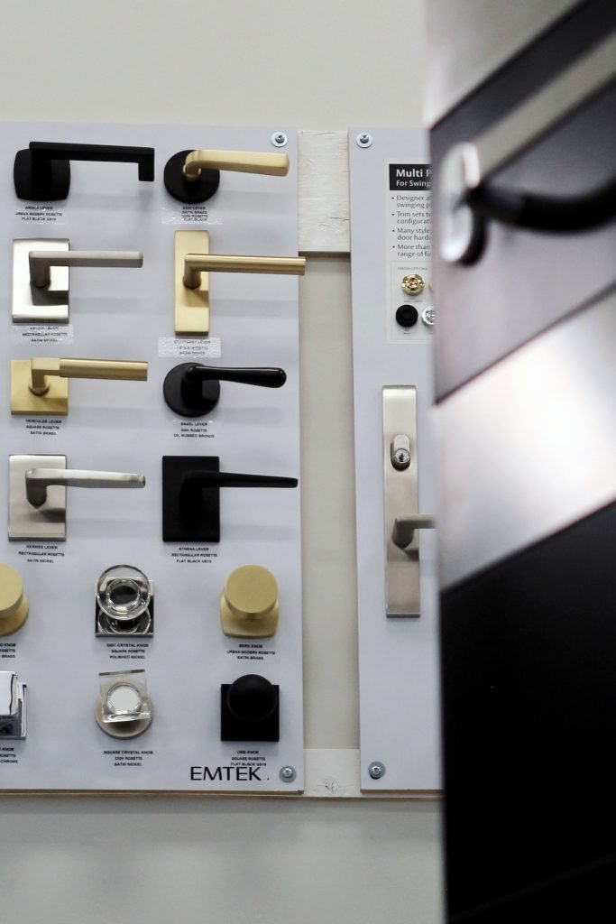 a group of door handles on a wall